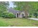 Quaint single-story home with well-maintained lawn and landscaping at 7112 Greenway Sw Cv, Covington, GA 30014