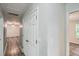 Hallway featuring modern gray-toned laminate floor at 7112 Greenway Sw Cv, Covington, GA 30014