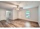 Spacious living room with natural light and contemporary flooring at 7112 Greenway Sw Cv, Covington, GA 30014