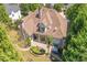 Aerial view of the home's backyard, featuring a hot tub and patio area at 8715 Islesworth Ct, Duluth, GA 30097