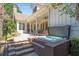 Beautiful backyard featuring a hot tub and a covered patio area, perfect for entertaining guests at 8715 Islesworth Ct, Duluth, GA 30097