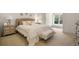 Neutral bedroom featuring soft carpet, natural light, and cozy textures at 8715 Islesworth Ct, Duluth, GA 30097