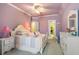 Lovely bedroom with lilac walls, plush carpet, and a whimsical collection of toys and decorations at 8715 Islesworth Ct, Duluth, GA 30097