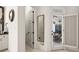 Hallway leading to the back patio and featuring a half bathroom at 8715 Islesworth Ct, Duluth, GA 30097