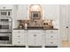 A kitchen features stainless steel appliances, granite counters, and decorative tile backsplash at 8715 Islesworth Ct, Duluth, GA 30097