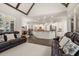 An open-concept living room and kitchen features hardwood floors and plenty of natural light at 8715 Islesworth Ct, Duluth, GA 30097