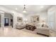 Bright and spacious living room with neutral decor and a view of the front entrance from the open concept floorplan at 8715 Islesworth Ct, Duluth, GA 30097