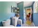 Bathroom with a white sink vanity, a mirror and wood-look flooring at 151 Grandma Branch Rd, Grantville, GA 30220