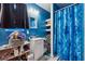 Bathroom with a blue painted wall, a sink vanity and wood-look flooring at 151 Grandma Branch Rd, Grantville, GA 30220