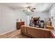 A cozy bedroom featuring hard surface flooring and neutral walls with an ensuite bath at 151 Grandma Branch Rd, Grantville, GA 30220