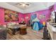 Bedroom with a pink painted wall, hardwood flooring and tray ceiling at 151 Grandma Branch Rd, Grantville, GA 30220
