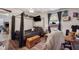 Bedroom with a canopy bed, wood-look flooring, and natural light at 151 Grandma Branch Rd, Grantville, GA 30220