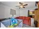 Bedroom with ceiling fan, wood-look floors, and neutral gray walls at 151 Grandma Branch Rd, Grantville, GA 30220