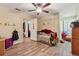 Bedroom with hardwood flooring, natural light, and dinosaur decorations at 151 Grandma Branch Rd, Grantville, GA 30220