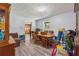 A casual dining room with wood-look floors, a dining table, and a view into the kitchen at 151 Grandma Branch Rd, Grantville, GA 30220