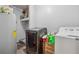 Functional laundry room with a washer, dryer, and hot water tank for convenience and efficiency at 151 Grandma Branch Rd, Grantville, GA 30220
