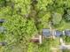 Aerial view of the property surrounded by mature trees at 1528 Alder Sw Ln, Atlanta, GA 30311