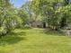 Sprawling backyard with mature trees and deck at 1528 Alder Sw Ln, Atlanta, GA 30311