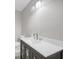 Bathroom vanity with marble countertop, and modern lighting at 1528 Alder Sw Ln, Atlanta, GA 30311
