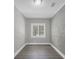 Bedroom with a window and a modern accent wall at 1528 Alder Sw Ln, Atlanta, GA 30311