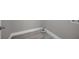 A gray laundry room featuring neutral gray wall paint and a gray stone-look tile floor at 1528 Alder Sw Ln, Atlanta, GA 30311