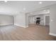 Open-concept living space with gray walls, recessed lighting, and laminate flooring overlooking the kitchen at 1528 Alder Sw Ln, Atlanta, GA 30311