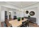 Dining room with contemporary lighting fixtures, trim accents, and neutral-toned walls at 1628 Baytree Dr, Cumming, GA 30040