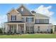 Stunning two-story home with a brick facade, well-manicured lawn, and professional landscaping at 1628 Baytree Dr, Cumming, GA 30040