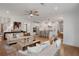 Open-concept living room with hardwood floors, neutral decor, and lots of natural light at 1628 Baytree Dr, Cumming, GA 30040