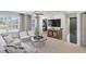 Upstairs loft area with a sofa, chairs, TV, and a view of the outdoors at 1628 Baytree Dr, Cumming, GA 30040