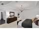 Modern main bedroom boasts decorative lighting, elegant furniture, and en-suite bath access at 1628 Baytree Dr, Cumming, GA 30040