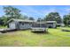 Backyard with a trampoline, fire pit and two car garage at 205 Tamea Trl, Covington, GA 30014