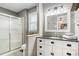 Well-lit bathroom with a vanity, shower, and modern fixtures at 205 Tamea Trl, Covington, GA 30014