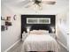 Comfortable bedroom with a ceiling fan and a view of the backyard at 205 Tamea Trl, Covington, GA 30014
