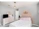This bedroom features neutral paint, carpet and a nice light fixture at 205 Tamea Trl, Covington, GA 30014