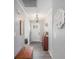 Stylish hallway featuring modern lighting, wood-look floors, and neutral paint, creating a welcoming entry at 205 Tamea Trl, Covington, GA 30014