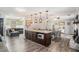 Open kitchen layout with a large island, granite countertops and pendant lighting at 205 Tamea Trl, Covington, GA 30014