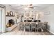 Spacious open concept connecting dining and kitchen, featuring a brick fireplace and stainless appliances at 205 Tamea Trl, Covington, GA 30014