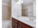 Spacious bathroom featuring dual sinks, a soaking tub, and a shower at 4905 Greylock Se Walk, Atlanta, GA 30339