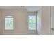 Empty bedroom with two windows at 4905 Greylock Se Walk, Atlanta, GA 30339