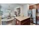Modern kitchen area with granite countertops and a stainless steel refrigerator at 4905 Greylock Se Walk, Atlanta, GA 30339