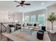 Open living room with hardwood floors, plush seating, and stylish decor at 4905 Greylock Se Walk, Atlanta, GA 30339