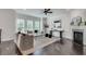 Light-filled living room with fireplace, hardwood floors, and stylish neutral furniture at 4905 Greylock Se Walk, Atlanta, GA 30339