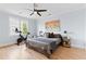 Bedroom with exercise bike, ceiling fan, large windows, and beautiful hardwood floors at 1671 Laurel Nw Ave, Atlanta, GA 30318