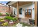 Inviting front porch with a swing, wood columns, and double doors at 1671 Laurel Nw Ave, Atlanta, GA 30318