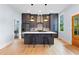 Contemporary kitchen with dark cabinets, center island and stainless steel appliances at 1671 Laurel Nw Ave, Atlanta, GA 30318
