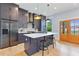 Kitchen featuring dark cabinets, stainless steel appliances and center island at 1671 Laurel Nw Ave, Atlanta, GA 30318