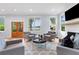 Well-lit living room boasts a fireplace and a double glass door at 1671 Laurel Nw Ave, Atlanta, GA 30318