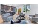 Open concept living space with gray kitchen and armchairs at 1671 Laurel Nw Ave, Atlanta, GA 30318