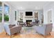 Bright living room featuring a fireplace, hardwood floors, and ample natural light at 1671 Laurel Nw Ave, Atlanta, GA 30318